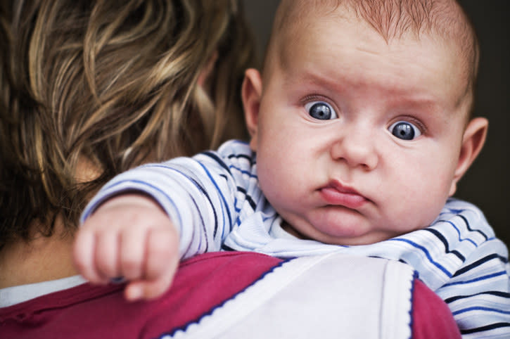 A baby with an agitated expression