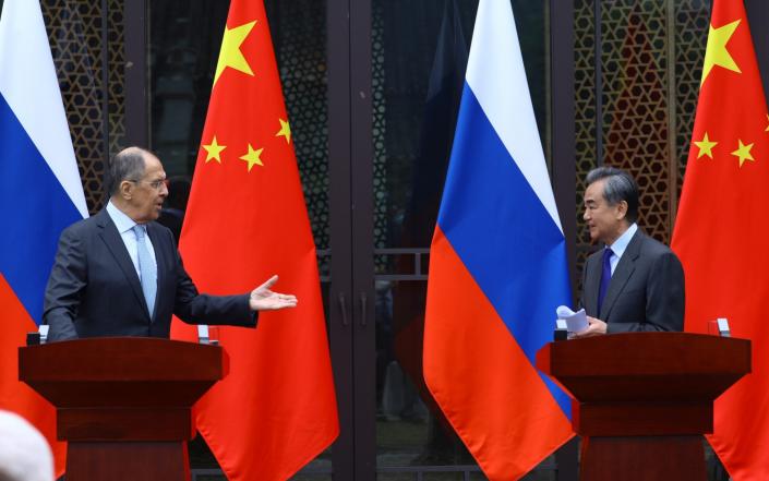 Russian Foreign Minister Sergei Lavrov, left, held talks with his Chinese counterpart, Wang Yi, on Tuesday - Russian Foreign Ministry Handout via Reuters/Russian Foreign Ministry Handout via Reuters