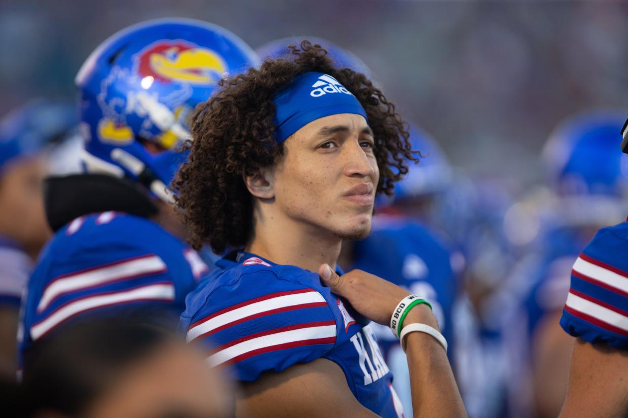 Kansas redshirt senior quarterback Jason Bean (9) looks on from the sidelines during the first quarter of Friday's game against Missouri State inside David Booth Kansas Memorial Stadium.