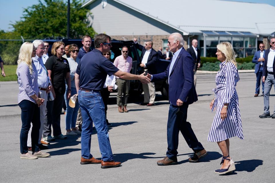 President Joe Biden and first lady Jill Biden are greeted by Kentucky Gov Andy Beshear (AP)
