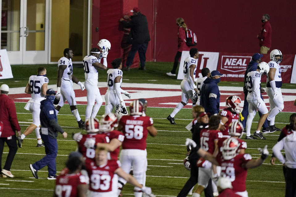 Penn State players leave the field as Indiana players celebrate following an NCAA college football game, Saturday, Oct. 24, 2020, in Bloomington, Ind. Indiana won 36-35 in overtime. (AP Photo/Darron Cummings)