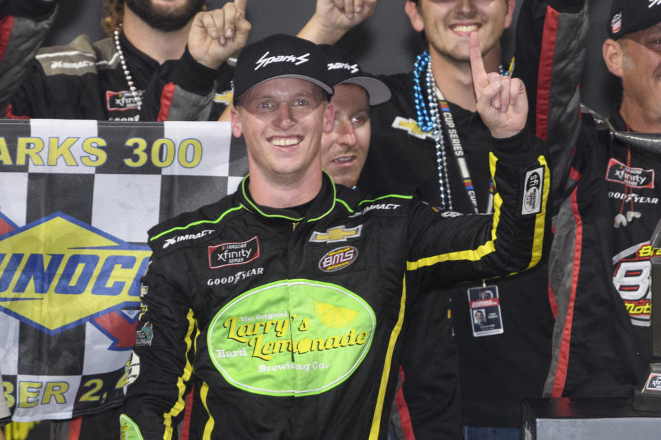 Brandon Brown celebrates in Victory Lane after winning a NASCAR Xfinity Series auto race Saturday, Oct. 2, 2021, in Talladega, Ala. (AP Photo/John Amis)