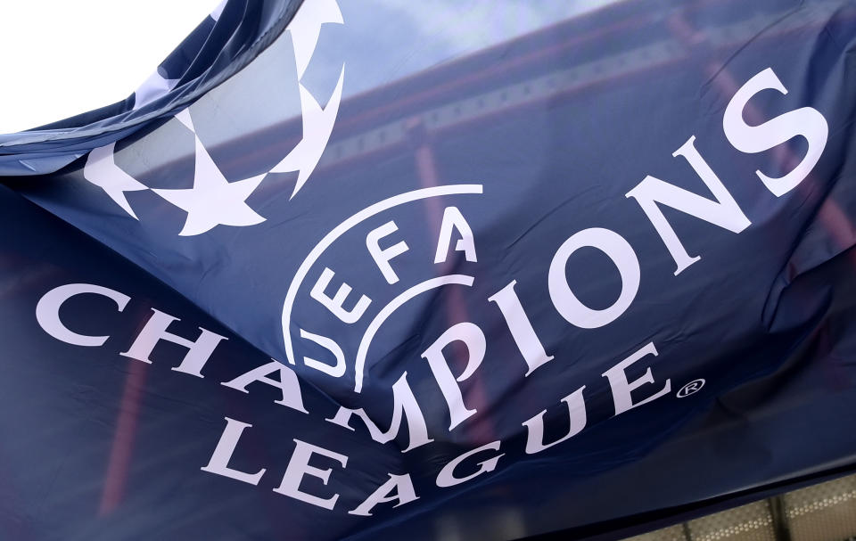 The UEFA Champions League logo is shown on a banner.