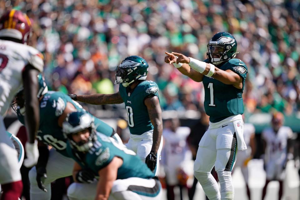 Philadelphia Eagles quarterback Jalen Hurts (1) gestures during the first half of an NFL football game against the Washington Commanders on Sunday, Oct. 1, 2023, in Philadelphia.