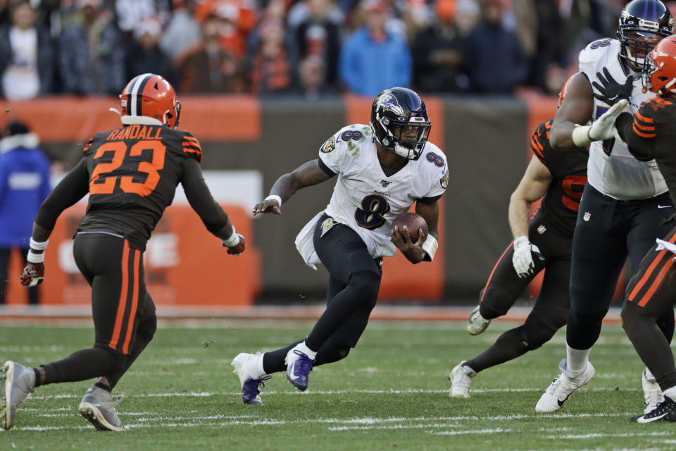 Baltimore Ravens quarterback Lamar Jackson (8) scrambles against the Cleveland Browns during the second half of an NFL football game, Sunday, Dec. 22, 2019, in Cleveland. The Ravens won 31-15. (AP Photo/Ron Schwane)