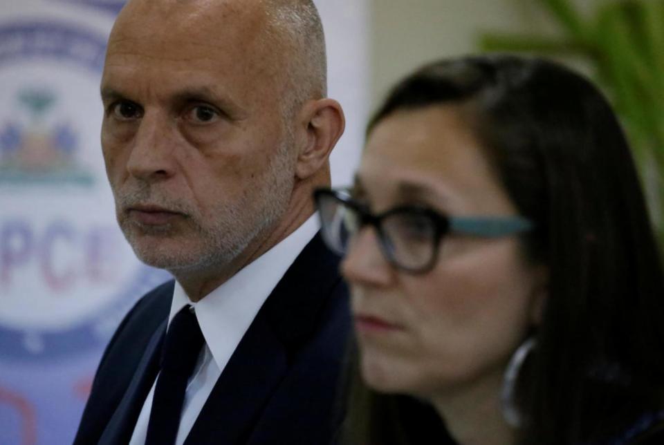 Simon Ticehurst, and Oxfam Intermon Executive Affiliate Unit head, Margalida Massot, are seen before a meeting with Haiti's Minister of Planning and External Cooperation Aviol Fleurant in Port-au-Prince, Haiti (REUTERS)