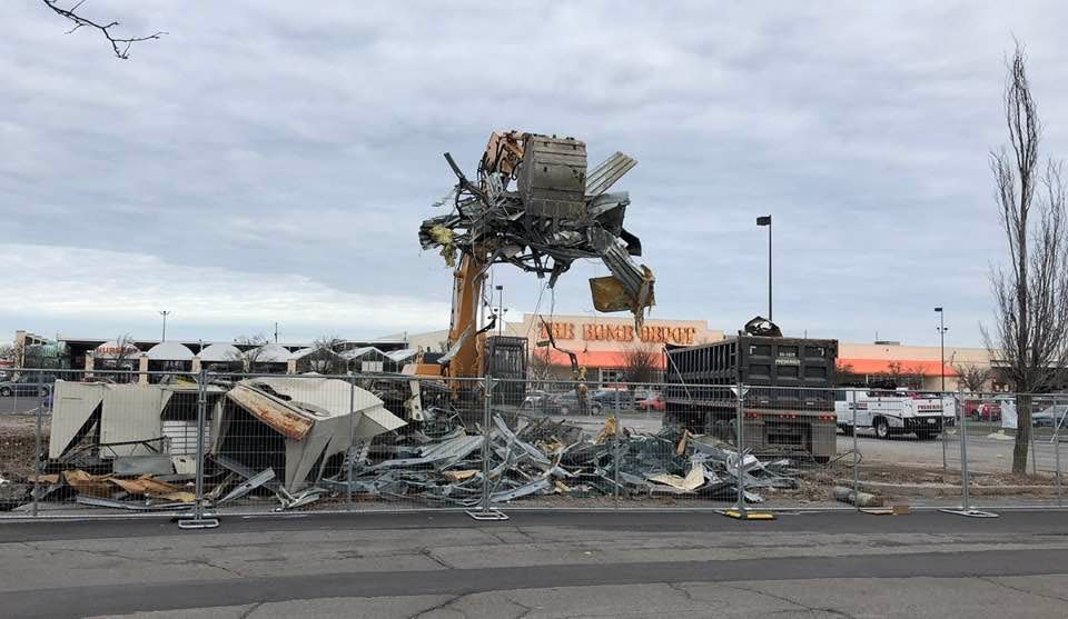 The remains of Romano's Macaroni Grill at 760 Jefferson Road, Henrietta, are loaded into a dumpster on Dec. 2, 2022.