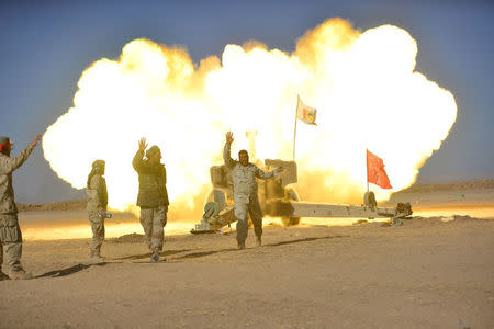 Shi'ite fighters fire artillery towards Islamic State militants during a battle with Islamic State militants on the outskirt of Tal Afar west of Mosul, Iraq, November 18, 2016. REUTERS/Stringer