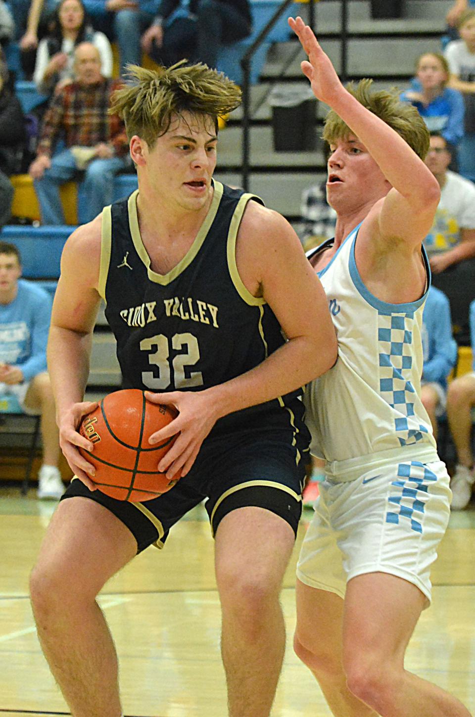 Sioux Valley's Hudsyn Ruesink works in the lane against Hamlin's Tyson Stevenson during their high school boys basketball game on Monday, Feb. 5, 2024 at the Hamlin Education Center. No. 2 Hamlin topped No. 4 Sioux Valley 80-48 in a battle of rated Class A teams.