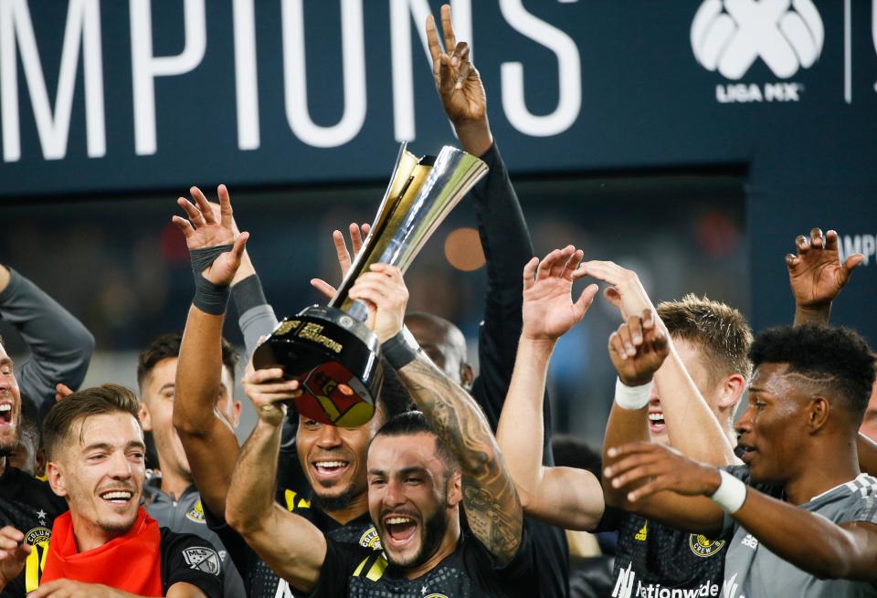 Columbus Crew defender Josh Williams (3) raises the Campeones Cup following the Crew's 2-0 victory against Cruz Azul on Wednesday, Sept. 29, 2021 at Lower.com Field in Columbus, Ohio.