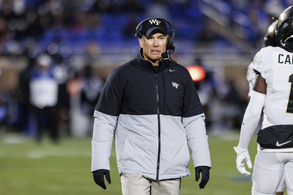Wake Forest head coach Dave Clawson walks off the field after a time out during the first half of an NCAA college football game against Duke in Durham, N.C., Thursday, Nov. 2, 2023. (AP Photo/Ben McKeown)