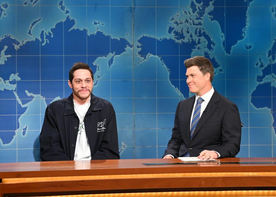 SATURDAY NIGHT LIVE -- Natasha Lyonne, Japanese Breakfast Episode 1826 -- Pictured: (l-r) Pete Davidson and anchor Colin Jost during Weekend Update on Saturday, May 14, 2022 -- (Photo by: Will Heath/NBC/NBCU Photo Bank via Getty Images)