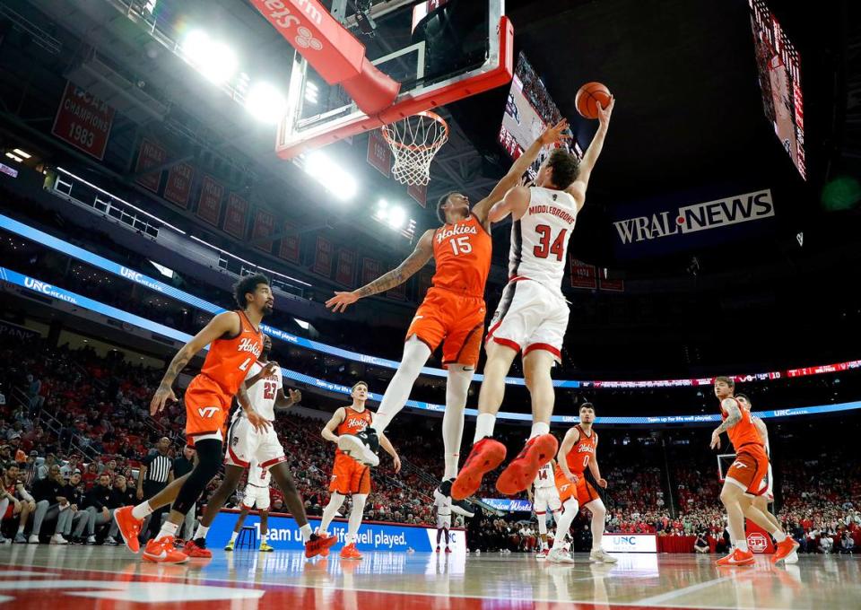 N.C. State’s Ben Middlebrooks shoots over Virginia Tech’s Lynn Kidd during the first half of the Wolfpack’s game on Saturday, Jan. 20, 2024, at PNC Arena in Raleigh, N.C.