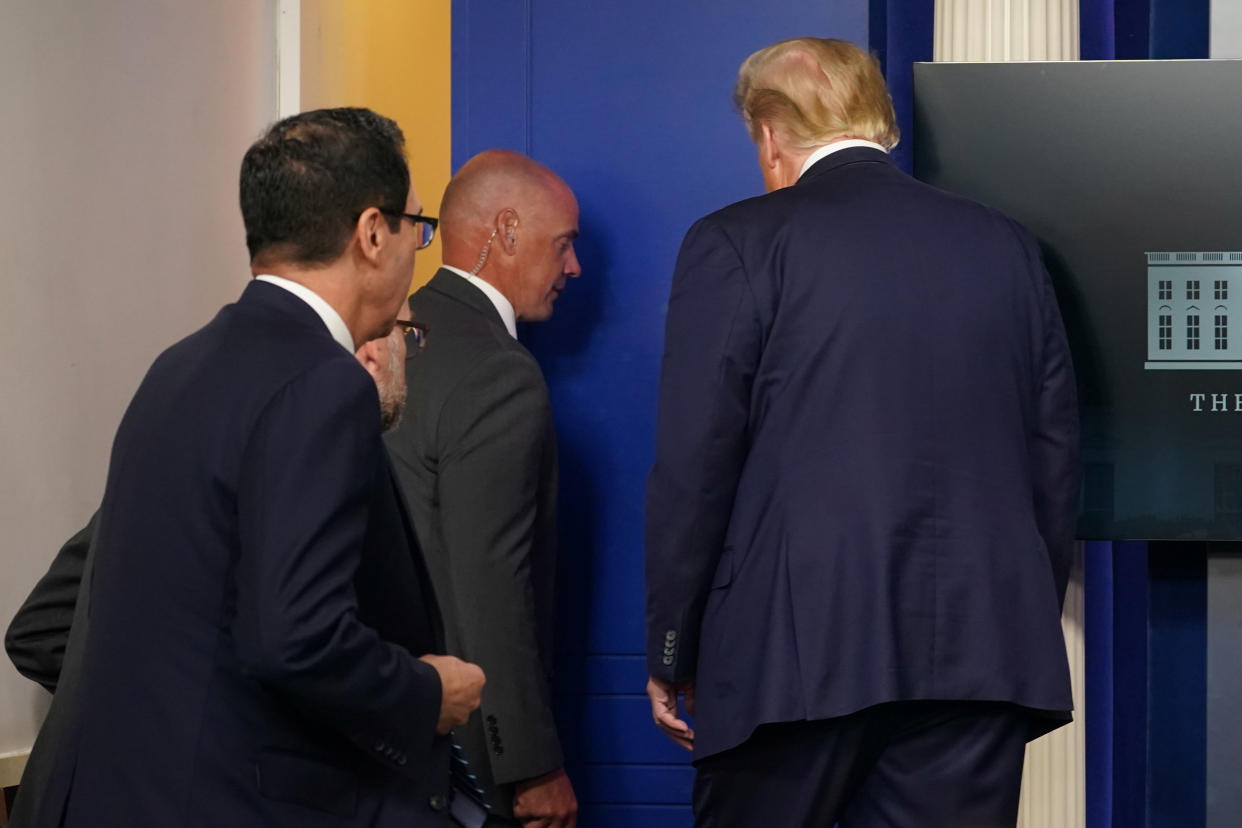 President Donald Trump leaves toward the beginning of a coronavirus disease (COVID-19) pandemic briefing at the White House in Washington, U.S., August 10, 2020 after Secret Service calls him away due to a shooting outside of the White House. (Kevin Lamarque/Reuters)