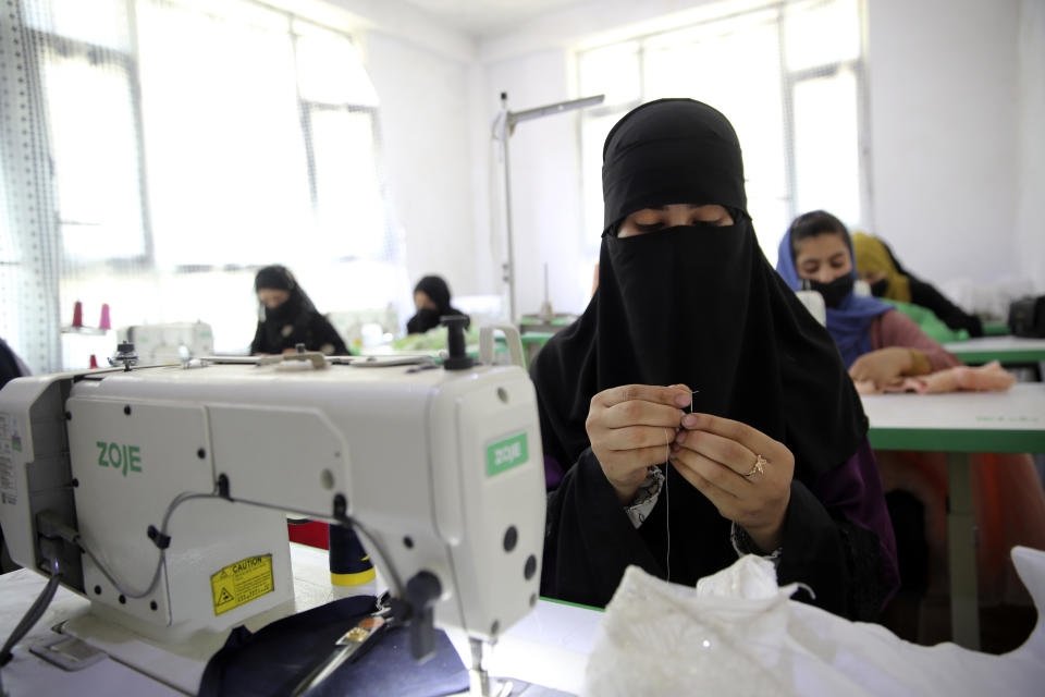Afghan women tailors work with a sewing machine in the Afghan Women Business Hub in Kabul, Afghanistan, Tuesday, July 2, 2024. Half of Afghanistan's population now finds itself locked out of the freedom to work at a time when the country's economy is worse than ever, with few jobs available to women in the country. (AP Photo/Siddiqullah Alizai)