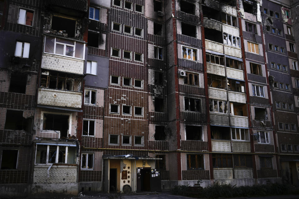 A view of a heavily damaged building caused by Russian rockets in Saltivka residential district, north Kharkiv, Ukraine, Saturday, Oct. 15, 2022. (AP Photo/Francisco Seco)