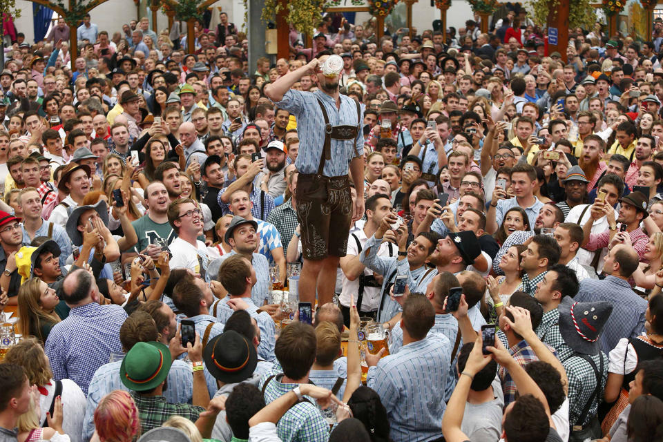 <p>A visitor drinks beer during the opening day of the 183rd Oktoberfest in Munich, Germany, Sept. 17, 2016. (Photo: Michaela Rehle/Reuters) </p>