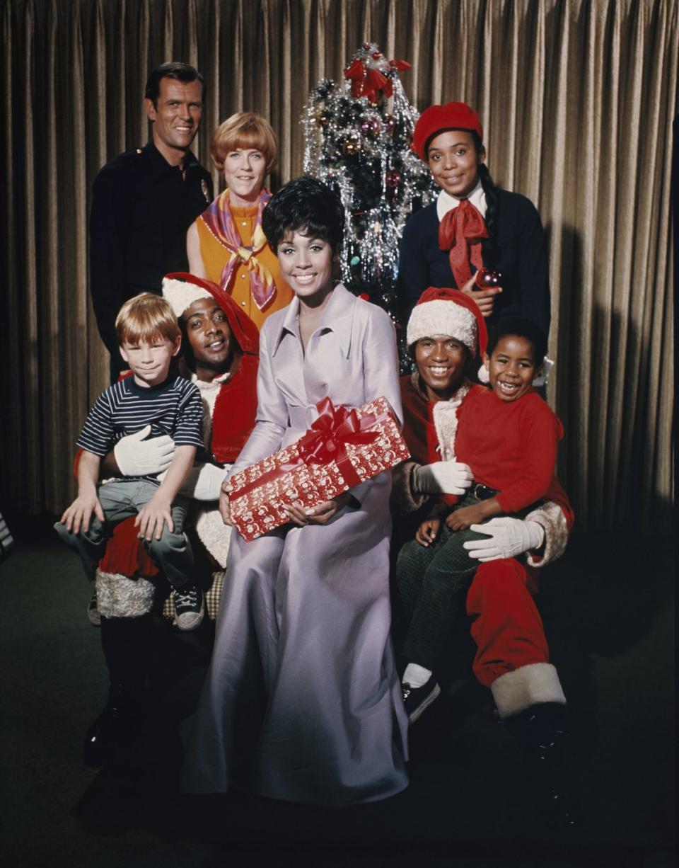 <p>Star of the hit television series, <em>Julia, </em>Diahann Carroll takes part in a seasonal promotional photoshoot with her costars. </p>