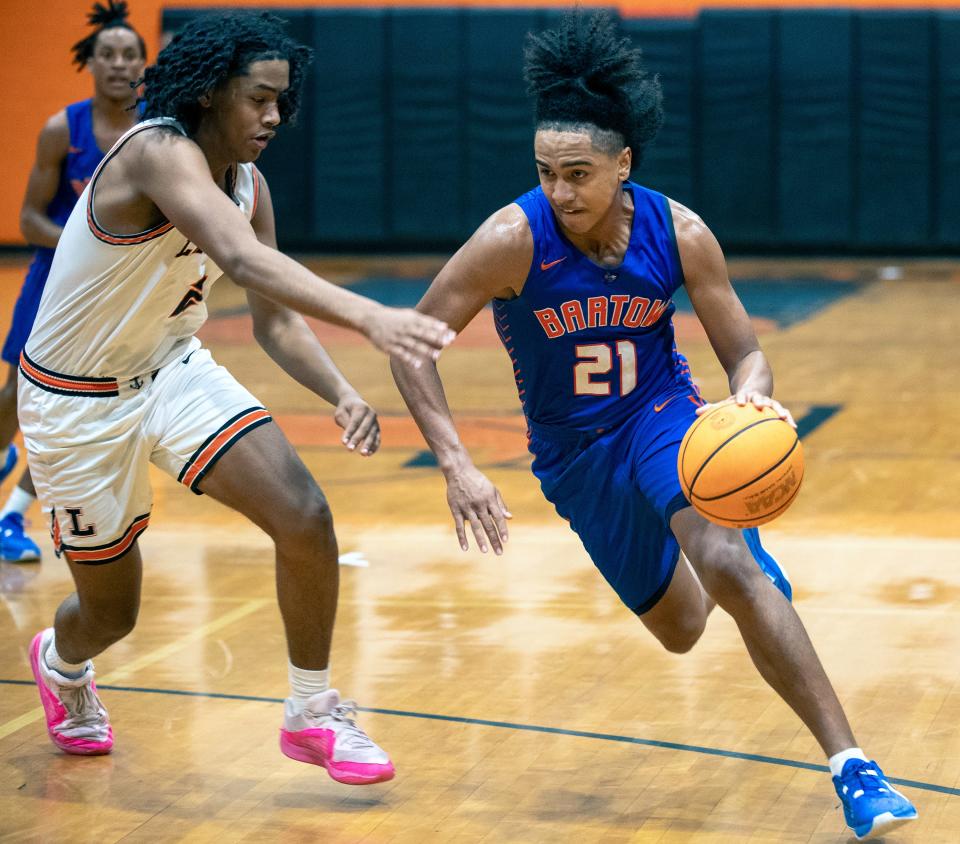 Bartow's Daniel Thompson drives to the basket against Lakeland on Saturday night in the championship game of the Class 6A, Distrct 7 boys basketball tournament.