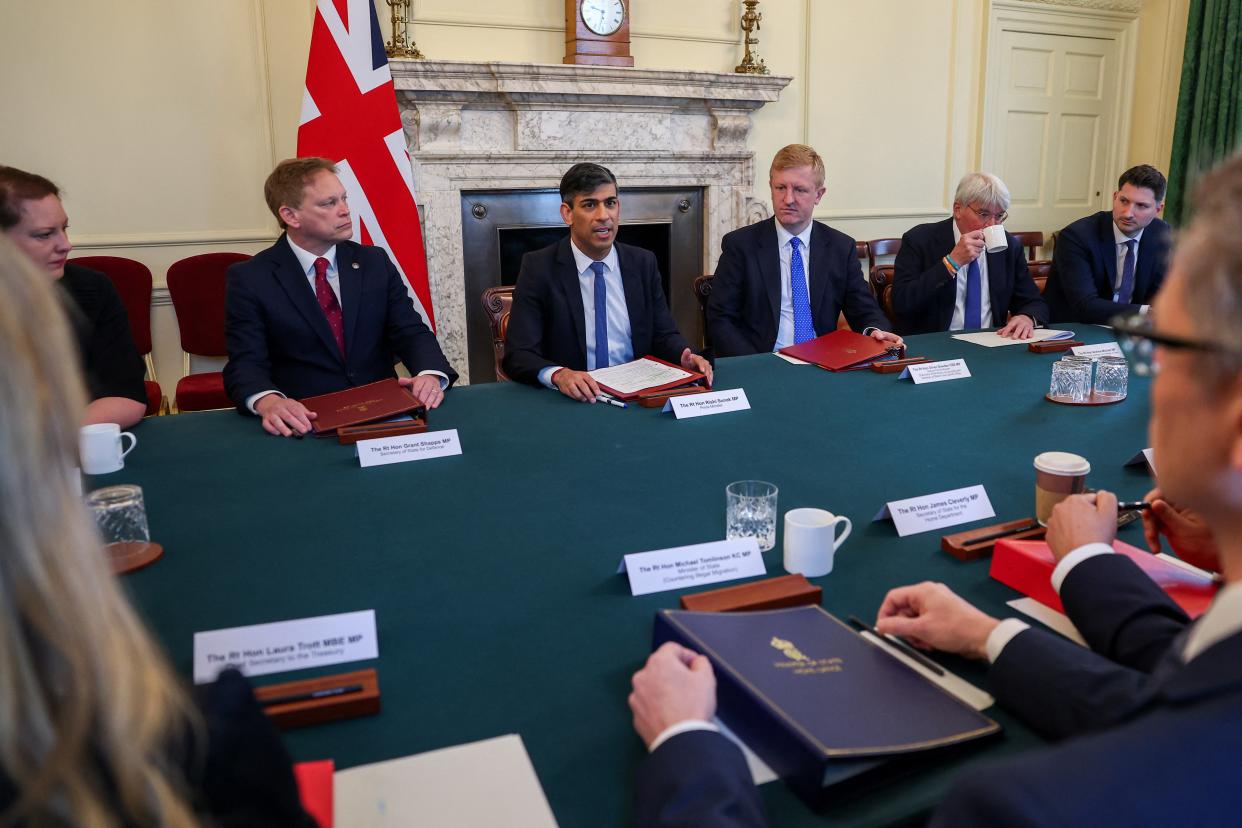 Rishi Sunak (centre) with (left to right) Defence Secretary Grant Shapps, Deputy Prime Minister Oliver Dowden and Andrew Mitchell, Minister of State for Development and Africa during an Illegal Migration Operations Committee meeting (Toby Melville/PA Wire)