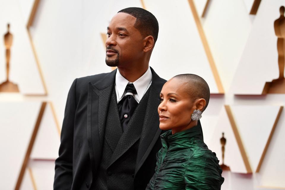 US actor Will Smith(L) and Jada Pinkett Smith attend the 94th Oscars at the Dolby Theatre in Hollywood, California on March 27, 2022. (Photo by Angela WEISS / AFP) / The erroneous mention[s] appearing in the metadata of this photo by Angela WEISS has been modified in AFP systems in the following manner: [Jada Pinkett Smith] instead of [Jada Pink Smith]. Please immediately remove the erroneous mention[s] from all your online services and delete it (them) from your servers. If you have been authorized by AFP to distribute it (them) to third parties, please ensure that the same actions are carried out by them. Failure to promptly comply with these instructions will entail liability on your part for any continued or post notification usage. Therefore we thank you very much for all your attention and prompt action. We are sorry for the inconvenience this notification may cause and remain at your disposal for any further information you may require. (Photo by ANGELA WEISS/AFP via Getty Images)