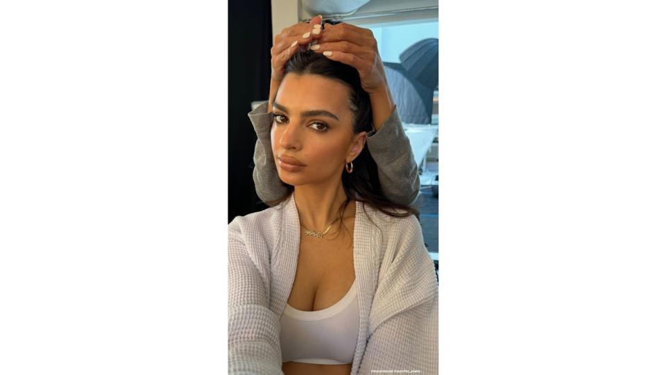 Emily Ratajkowski wearing a necklace with her son Sylvester's name on 