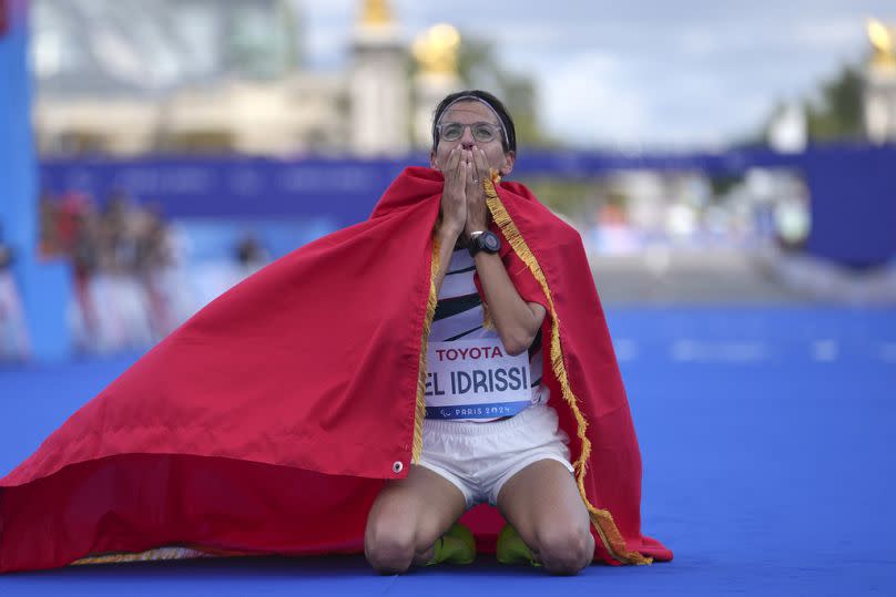 Morocco's Fatima Ezzahra El Idrissi celebrates her victory in the women's T12 marathon at the 2024 Paralympic Games, Sunday, Sept. 8, 2024, in Paris, France.