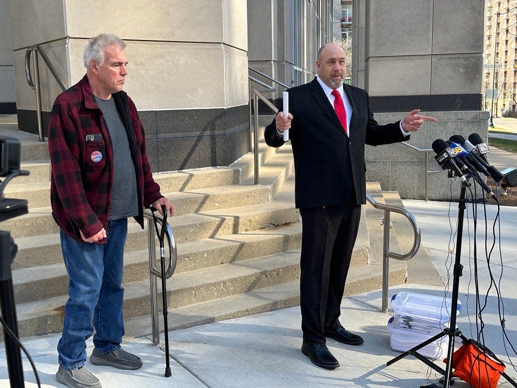 Matthew Snorek of Burlington, right, announces that an effort subject Assembly Speaker Robin Vos to a recall election in his district had gathered enough signatures to force the vote. The Wisconsin Elections Commission will meet Tuesday to discuss the petition against Vos. Joining him outside the state Capitol on Monday, March 11, 2024, is Harry Wait, who leads a Racine County group known as H.O.T. Government that promotes false claims of voter fraud in the 2020 election.