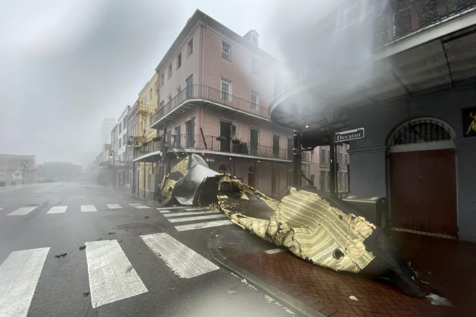 A section of a building's roof is seen after being blown off during rain and winds in the French Quarter of New Orleans, Louisiana on August 29, 2021 during Hurricane Ida. - Hurricane Ida slammed into the coast of Louisiana on August 29 as a powerful Category 4 storm, 16 years to the day after deadly Hurricane Katrina devastated the southern US city of New Orleans. (Photo by Patrick T. FALLON / AFP) (Photo by PATRICK T. FALLON/AFP via Getty Images)