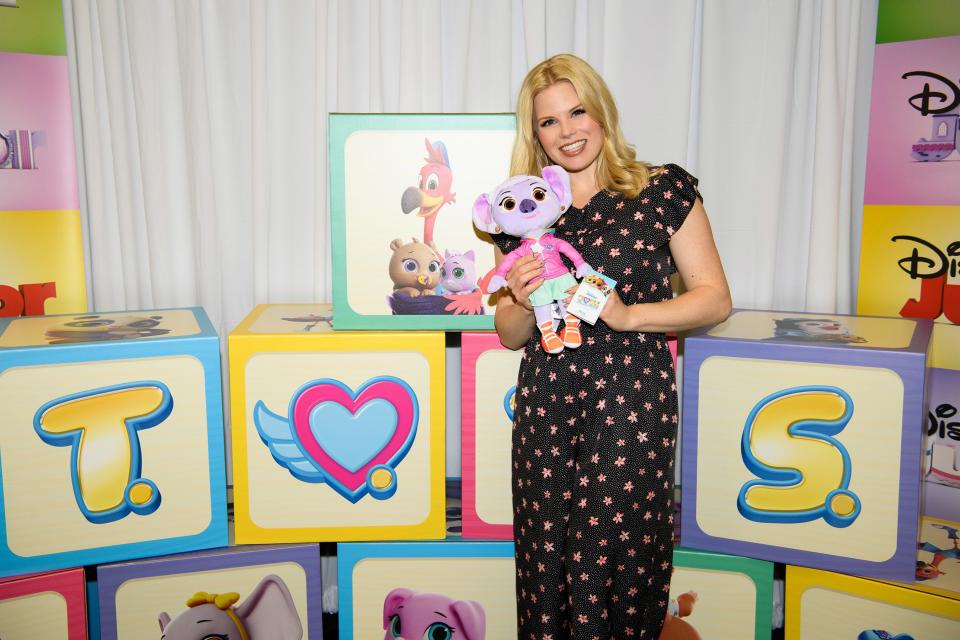 Megan Hilty, who voices K.C. the koala in Disney Junior's upcoming animated series <em>T.O.T.S.</em>, poses with the new Disney store|shopDisney plush at a blogger event in Burbank, California, on Friday. 