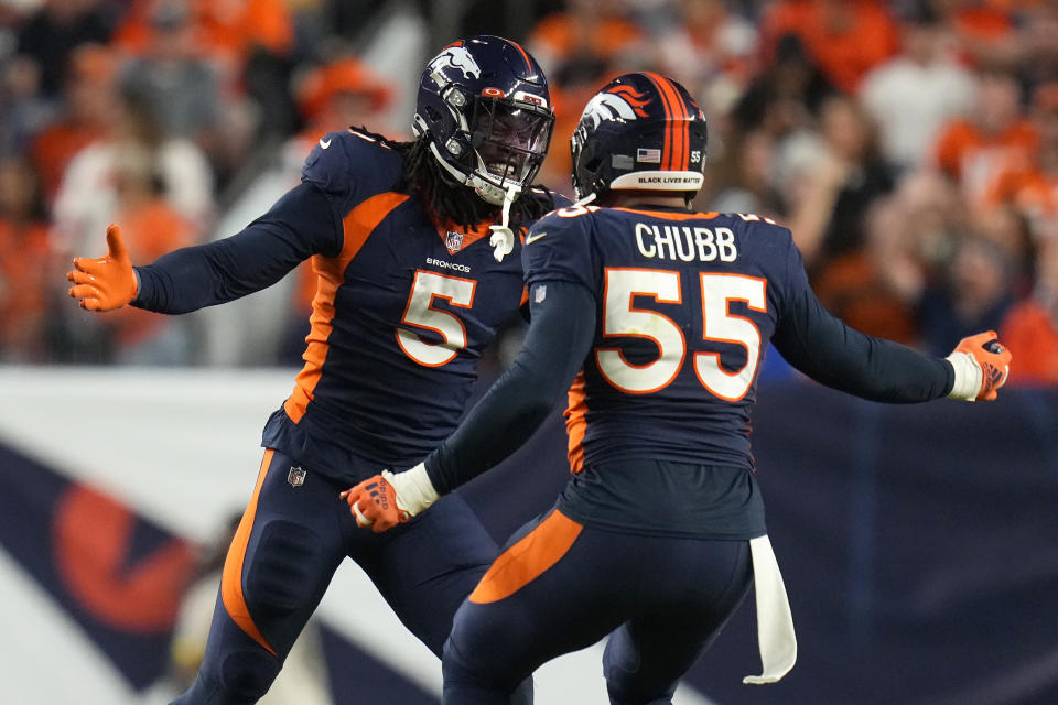 Denver Broncos linebacker Randy Gregory (5) celebrates linebacker Bradley Chubb (55) during the second half of an NFL football game against the San Francisco 49ers in Denver, Sunday, Sept. 25, 2022. (AP Photo/Jack Dempsey)