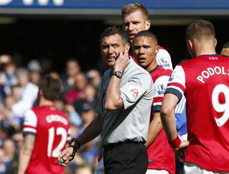 Referee Marriner reacts during the English Premier League soccer match between Arsenal and Chelsea at Stamford Bridge in London