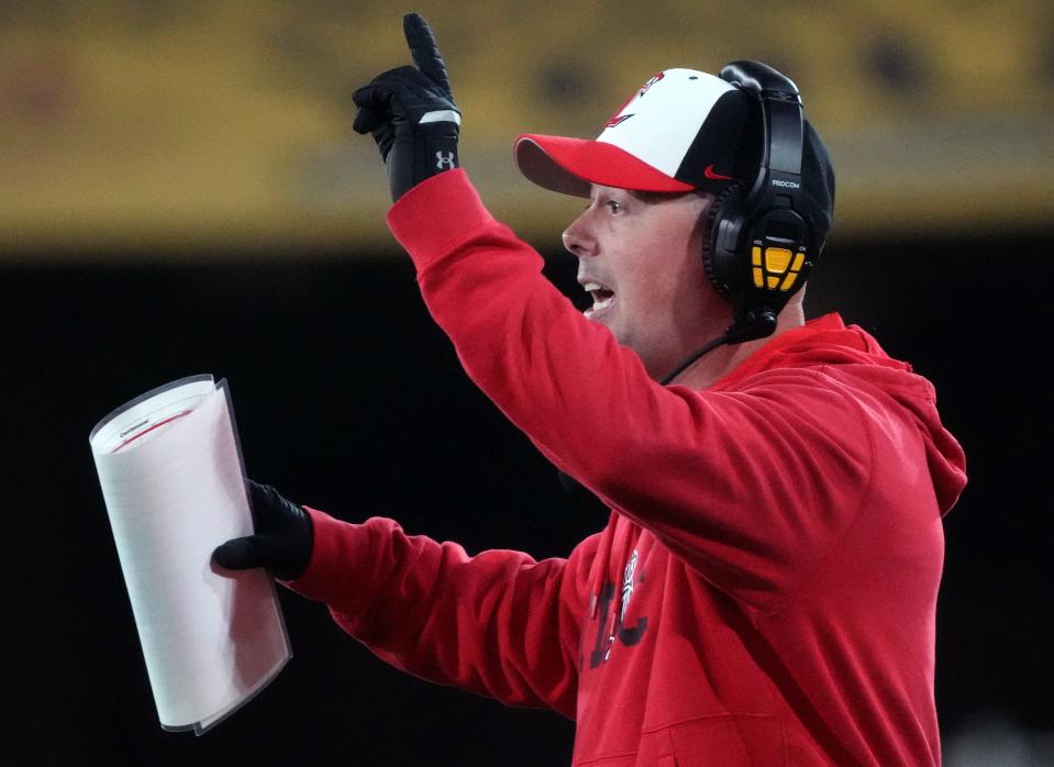 Liberty head coach Colin Thomas yells out to his team from the sideline as they play Centennial during their Open Division State Championship game at Mountain America Stadium in Tempe on Dec. 2, 2023.