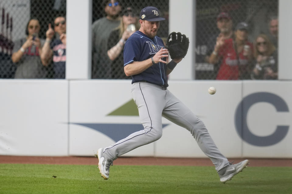 Tampa Bay Rays first baseman Luke Raley fields a ground ball hit for a single by Cleveland Guardians' Will Brennan in the fourth inning of a baseball game Saturday, Sept. 2, 2023, in Cleveland. (AP Photo/Sue Ogrocki)