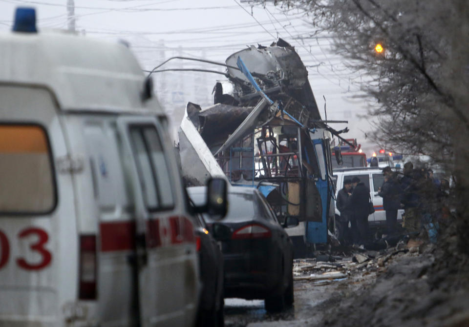 Members of the emergency services work at the site of a bomb blast on a trolleybus in Volgograd