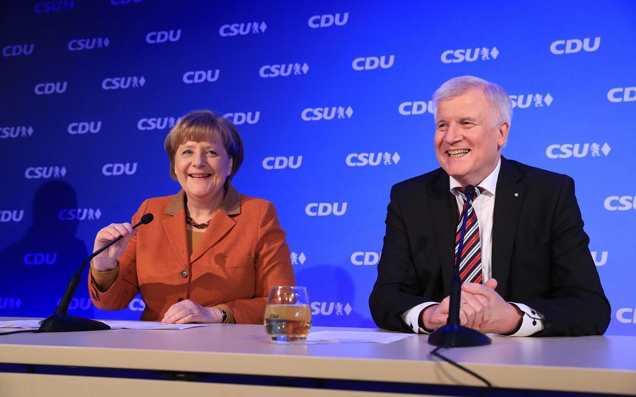 Angela Merkel, Germany's chancellor and leader of the Christian Democratic Union (CDU) party, left, and Horst Seehofer, Bavarian premier and leader of the Christian Social Union (CSU) party - © 2017 Bloomberg Finance LP