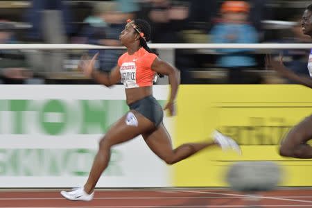 Shelly-Ann Fraser-Pryce of Jamaica (L) competes to win the women's 100m race ahead of Tori Bowie of the U.S. at the IAAF Athletics Diamond League meeting at Stockholm Olympic Stadium on July 30, 2015.