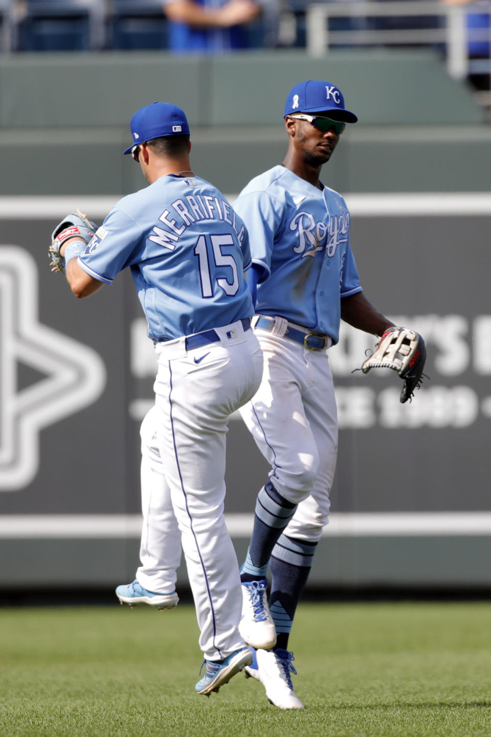 Kansas City Royals outfielders Whit Merrifield, left, and Michael A. Taylor, right, celebrate their win over the Boston Red Sox at the conclusion of a baseball game at Kauffman Stadium in Kansas City, Mo., Sunday, June 20, 2021. (AP Photo/Colin E. Braley)