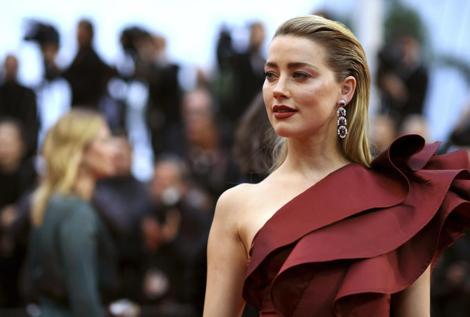 In this Friday, May 17, 2019 photo, actress Amber Heard poses for photographers upon arrival at the premiere of the film 'Pain and Glory' at the 72nd international film festival, Cannes, southern France. (Photo by Arthur Mola/Invision/AP)