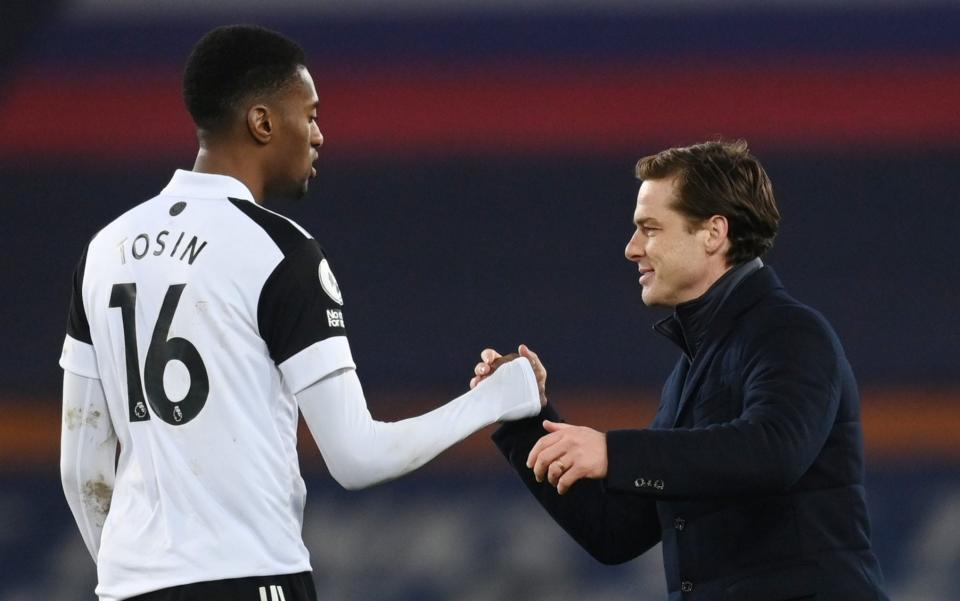 Fulham manager Scott Parker shakes hands with Tosin Adarabioyo after the match.  - REUTERS