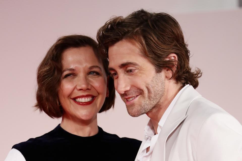 A picture of Maggie and Jake Gyllenhaal at the premiere of "The Lost Daughter" at Venice.