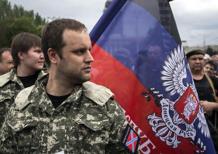 Pavel Gubarev, one of the leaders of the self-proclaimed Donetsk People's Republic, watches as fighters pledge an an oath during ceremony in the city of Donetsk June 21, 2014. REUTERS/Shamil Zhumatov