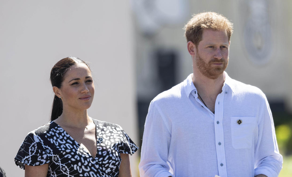 JULY 19th 2021: Prince Harry The Duke of Sussex to publish a memoir in 2022 about his life in the royal familly. - File Photo by: KGC-178/STAR MAX/IPx 2019 9/23/19 Prince Harry, Duke of Sussex, Meghan, Duchess of Sussex in South Africa. Their first engagement was to a Justice Desk initiative in Nyanga township, which teaches children about their rights, self-awareness and safety, and provides self-defence classes and female empowerment training to young girls in the community. The Justice Desk is an NGO supported by The Queen's Commonwealth Trust, of which The Duke serves as President and The Duchess as Vice-President. To date, the Justice Desk has directly assisted over 35,000 individuals, schools and communities. On arrival at Nyanga Methodist Church, The Duke and Duchess of Sussex met Jessica Dewhurst, Justice Desk Founder and Queen's Young Leader, and Theodora Luthuli, Justice Desk Community Leader. Jessica took Their Royal Highnesses on a walking tour of various activities taking place. Moving into the learning centre, Theodora introduced them to her mother and the centre's founder, Sylvia Hobe. Harry and Meghanl then observed the Mbokodo Girls' Empowerment programme, which provides self-defence classes and female empowerment training to young girls who have suffered major trauma. The project's motto is, 'waithint' abafazi wathint'imbokodo' (when you strike a women; you strike a rock). The session then began with the students reciting 'Our Deepest Fear,' the club's anthem. The girls then broke off into four training groups. Harry and Meghan were then escorted around the groups to learn about the purpose of each of the activities, before coming back together to form a circle where the girls had an opportunity to have a discussion with them in a private setting. Afterwards, Harry & Meghan left the learning centre, followed by the girls singing their team anthem.