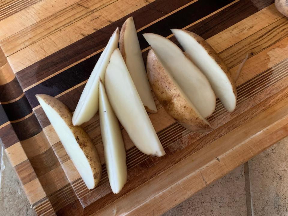 A potato cut into eighths