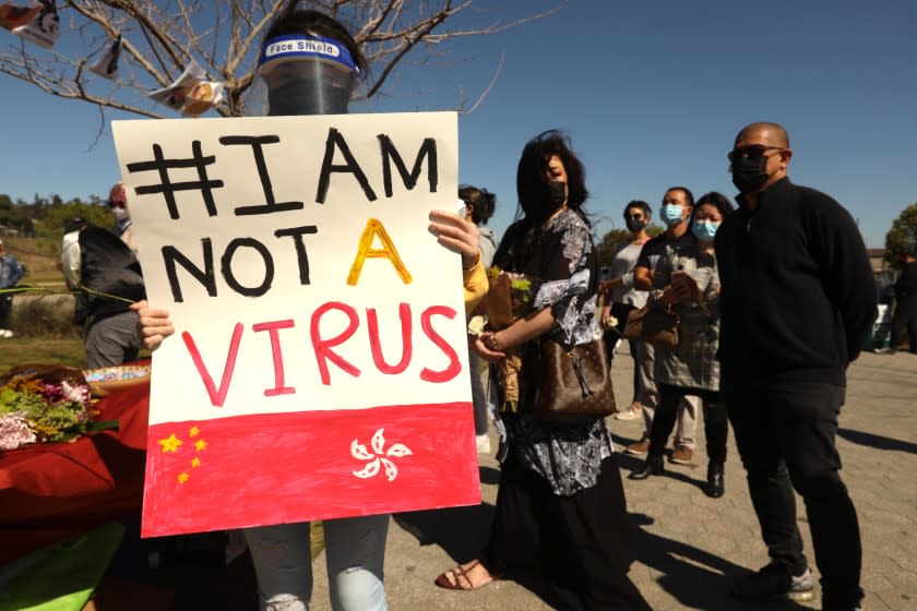 LOS ANGELES, CA - Tracy Wong, 19, makes a statement while attending a,"Rally Against Anti-Asian Hate Crimes & Racism," to raise awareness of anti-Asian violence at Los Angeles State Historic Park on February 20, 2021. The rally was organized in part in response to last month's fatal assault of Vicha Ratanapakdee, an 84-year-old immigrant from Thailand, in San Francisco. The rally included hate crime survivors and local Asian elder community members. (Genaro Molina / Los Angeles Times)