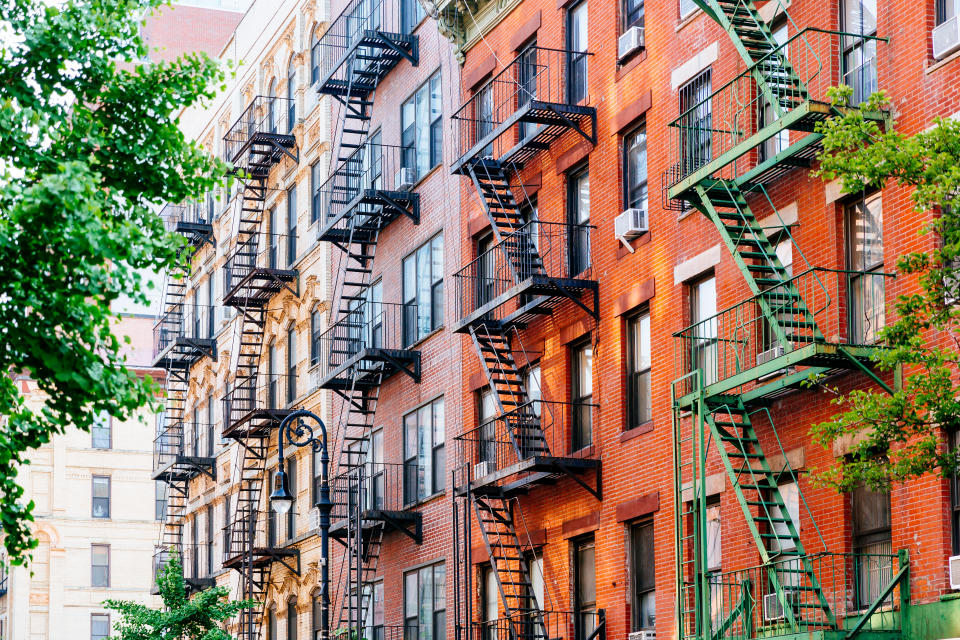 House facade with fire escape stairs in East Village, Manhattan, New York