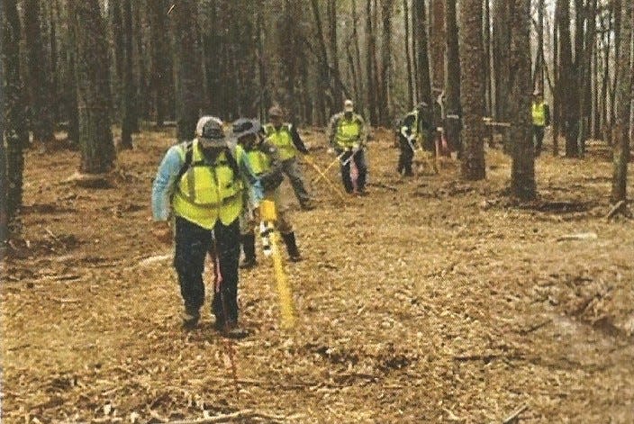 Contractors for the Army Corps of Engineers use  electromagnetic equipment to search for potentially unexploded devices at portions of Croft State Park where a former World War II camp trained soldiers.