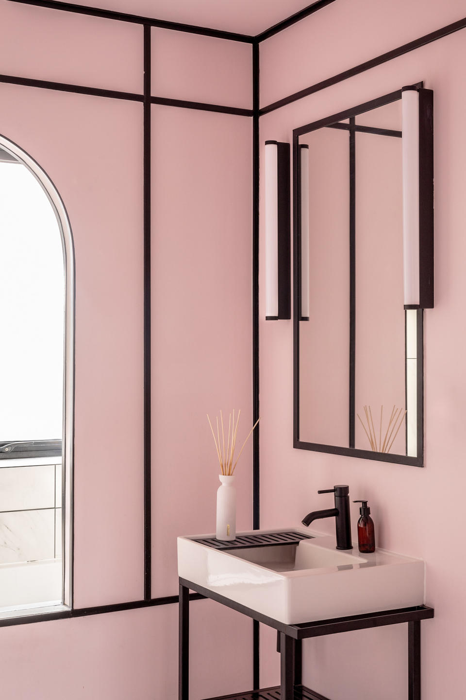 a bathroom with black painted paneling