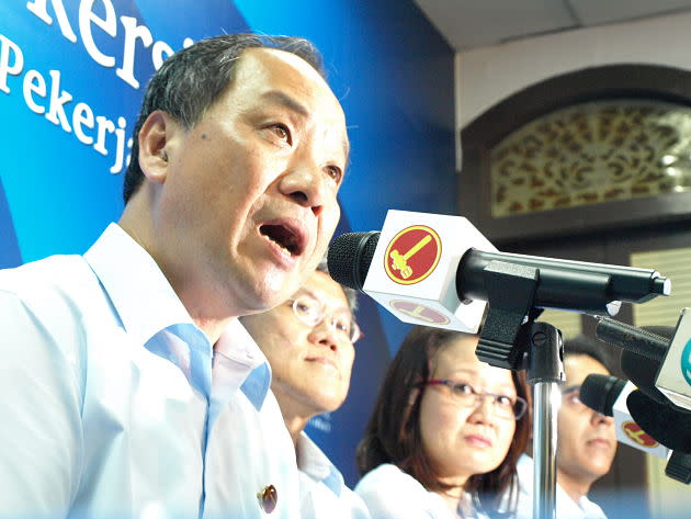 Workers' Party leader Low Thia Khiang speaks at a press conference at WP HQ after Hougang by-election results were announced. (Yahoo! Singapore/ Christine Choo)