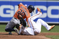 Houston Astros' Chas McCormick is tagged out by Baltimore Orioles second baseman Rougned Odor on a steal attempt in the third inning of a baseball game, Sunday, Sept. 25, 2022, in Baltimore. (AP Photo/Gail Burton)